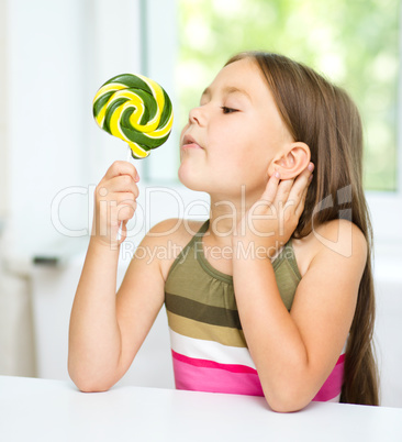 Little girl with lollipop