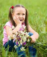 Portrait of a little girl with flowers
