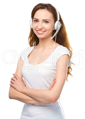 Lovely young woman is talking to customers