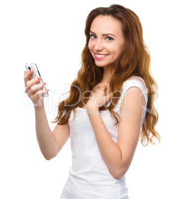 Young woman is pleased by incoming message