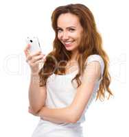 Young woman is pleased by incoming message