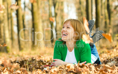 Portrait of a woman in autumn park