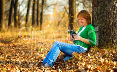 Portrait of a woman in autumn park