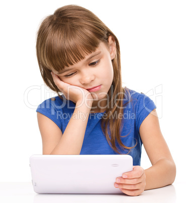 Young girl is using tablet