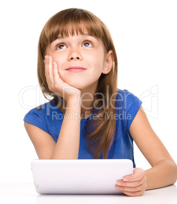 Young girl is using tablet