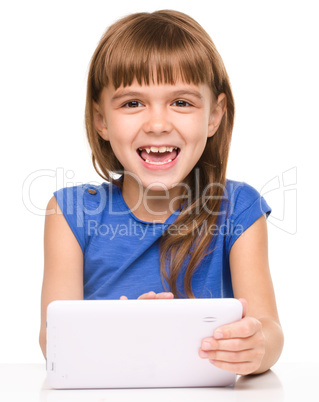 Young girl is using tablet