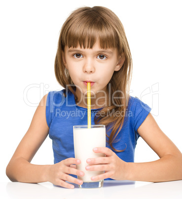 Cute little girl with a glass of milk