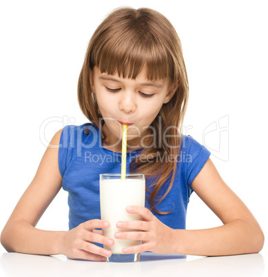 Cute little girl with a glass of milk