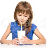 Cute little girl with a glass of milk