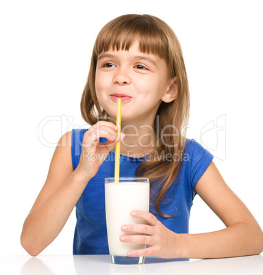 Cute little girl with a glass of milk