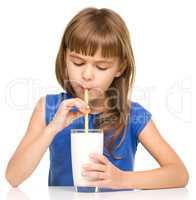 Cute little girl with a glass of milk