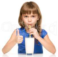 Cute little girl with a glass of milk