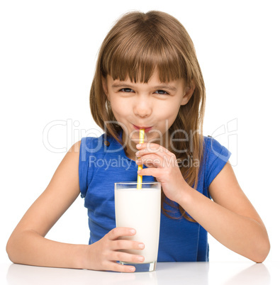 Cute little girl with a glass of milk