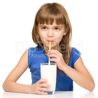 Cute little girl with a glass of milk