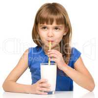 Cute little girl with a glass of milk