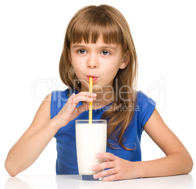 Cute little girl with a glass of milk