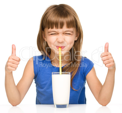 Cute little girl with a glass of milk