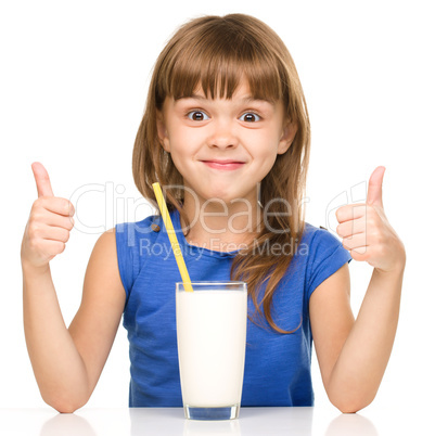 Cute little girl with a glass of milk