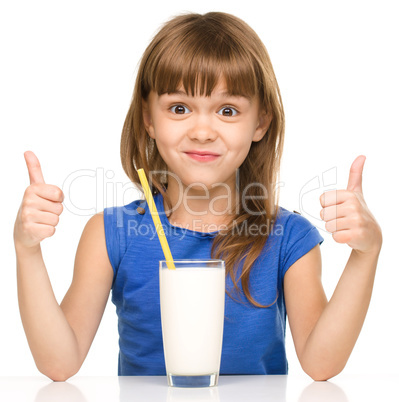 Cute little girl with a glass of milk