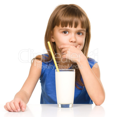 Cute little girl with a glass of milk