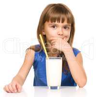 Cute little girl with a glass of milk