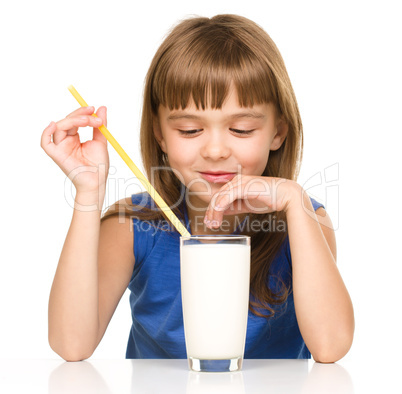 Cute little girl with a glass of milk