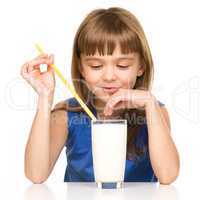 Cute little girl with a glass of milk