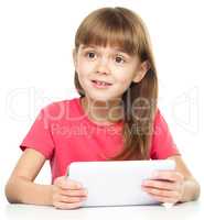 Young girl is using tablet