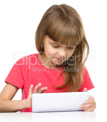 Young girl is using tablet