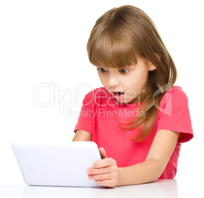 Young girl is using tablet