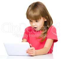 Young girl is using tablet