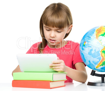 Young girl is using tablet