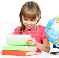 Young girl is using tablet