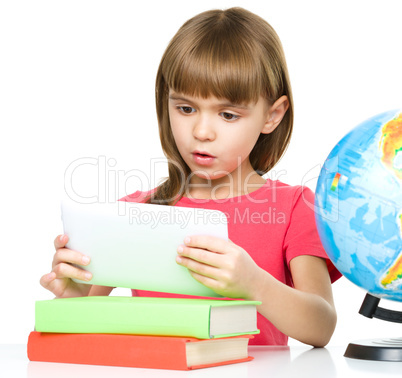 Young girl is using tablet