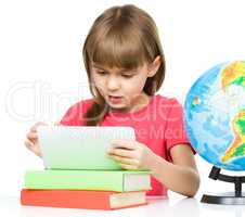 Young girl is using tablet