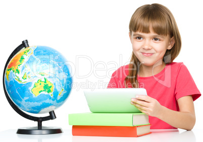 Young girl is using tablet