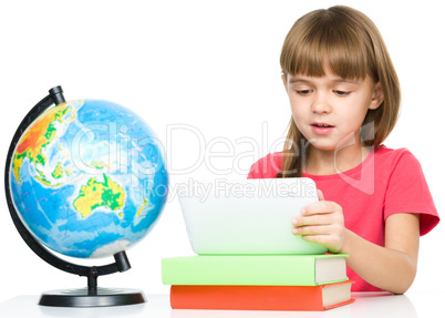 Young girl is using tablet