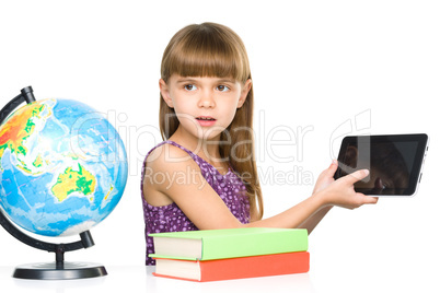 Young girl is showing tablet