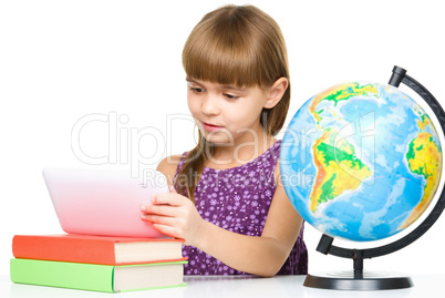 Young girl is using tablet