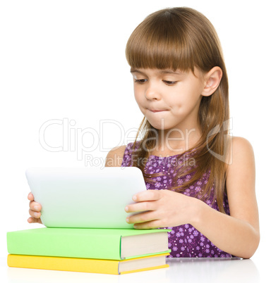 Young girl is using tablet