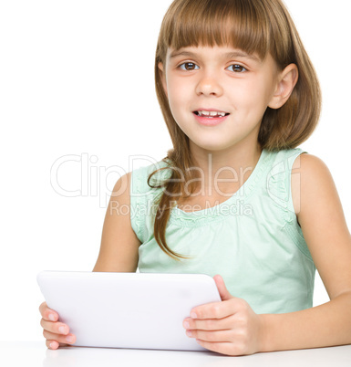 Young girl is using tablet