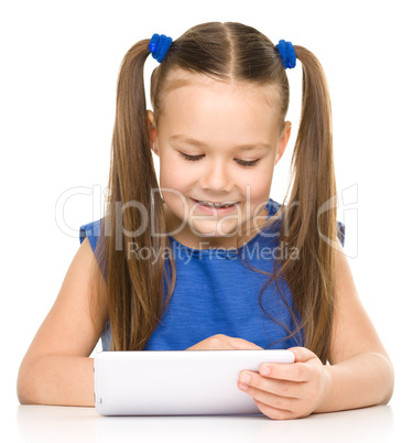 Young girl is using tablet