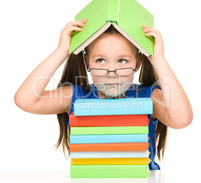 Little girl with books