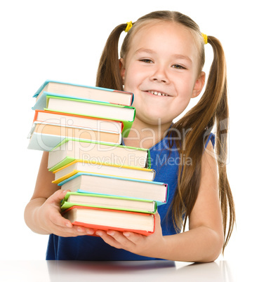 Little girl with books