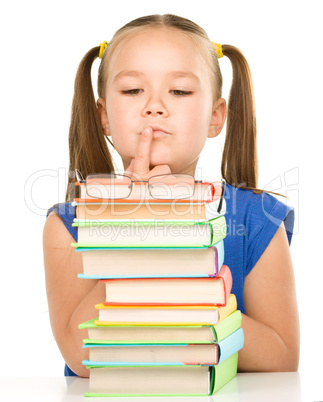 Little girl is showing her books