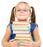 Little girl with books