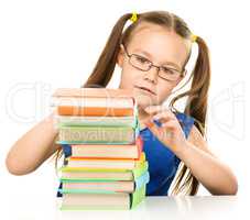 Little girl with books