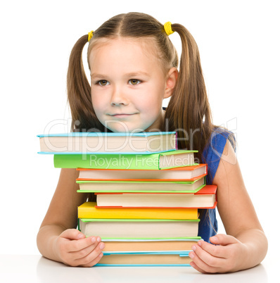 Little girl with books