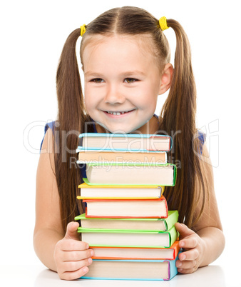 Little girl with books