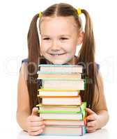 Little girl with books